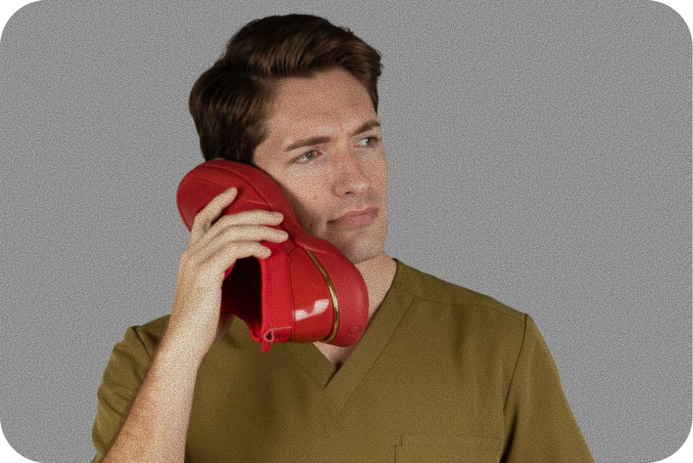 A person wearing white Snogs Dayshift shoes in a medical environment.